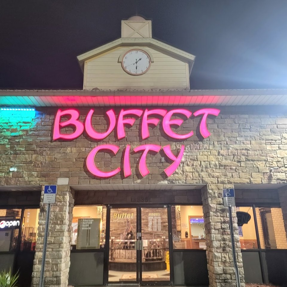 Buffet tables with sushi and hibachi stations.