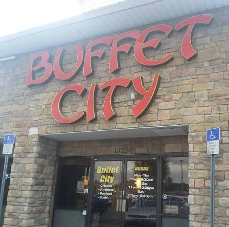 Buffet tables with sushi and hibachi stations.