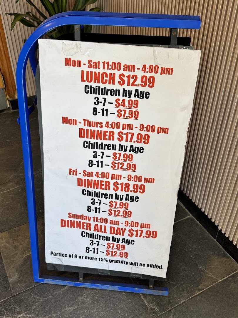 Asian buffet spread with salad bar and desserts.