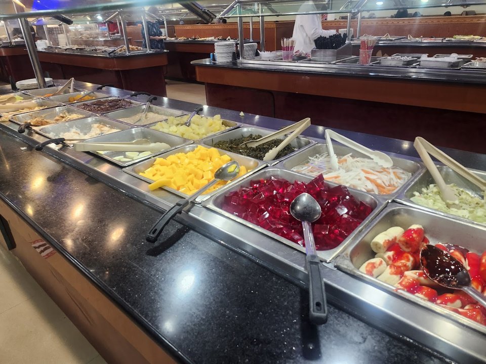 Modest decor inside a busy buffet restaurant.